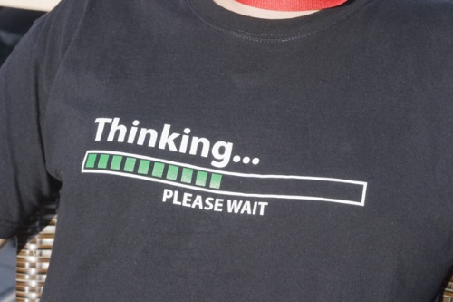 black t-shirt that says 'thinking...please wait'